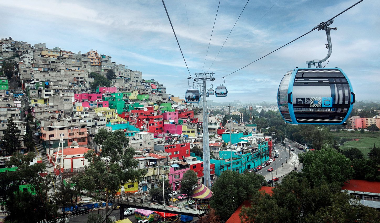 Photo of the ropeway in Mexico City, which gondolas above the rooftops and connects the workers' cuautepec district with the city's metro network.
